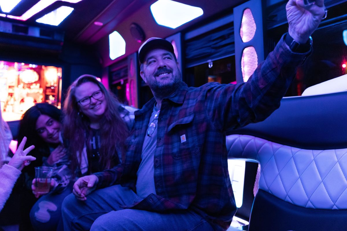 Friends taking a selfie on a party bus